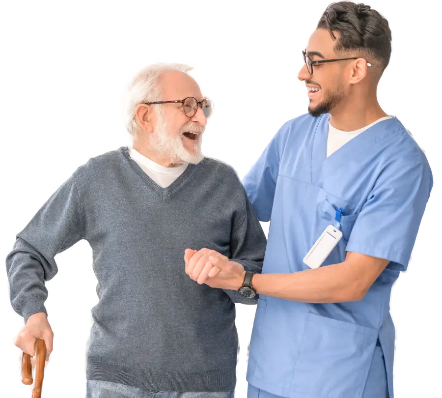 a younger caretaker standing with an older man laughing together